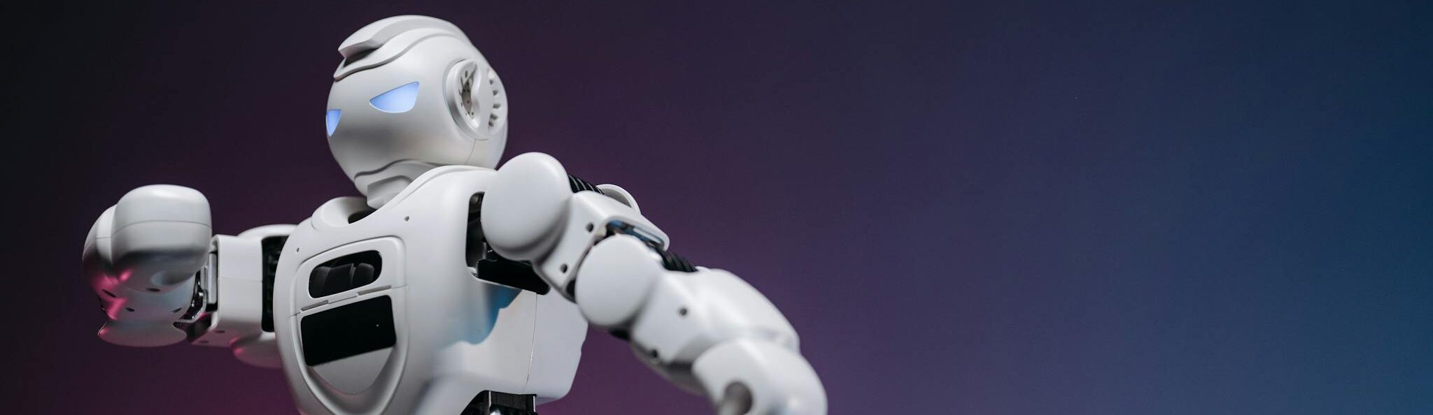 Close-up of a futuristic robotic toy against a gradient background, symbolizing innovation and technology.